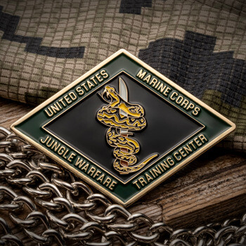 Diamond-shaped challenge coin featuring a snake wrapped around a knife with United States Marine Corps Jungle Warfare Training Center text.