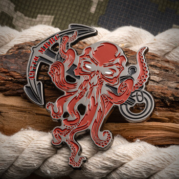 Custom shaped challenge coin featuring a red octopus skull with tentacles and an anchor design for the 497th MRBC.