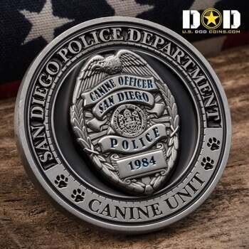Antiqued silver San Diego Police Canine Unit challenge coin featuring a 3D badge with an eagle and paw print accents.
