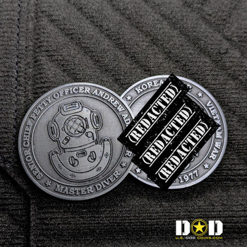Antiqued silver challenge coin featuring a master diver helmet design and service history text.