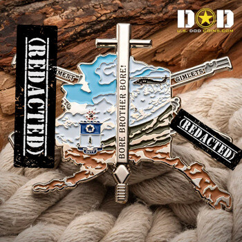 Alaska map shaped challenge coin featuring a helicopter, mountains, and a vertical bayonet design.
