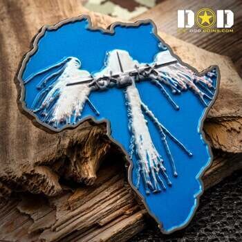 Africa shaped challenge coin featuring a blue background and a silver aircraft with flare trails.