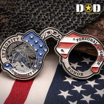Handcuff shaped challenge coin featuring St. Michael, American flag details, and the words Integrity, Community Support, and Personal Courage.