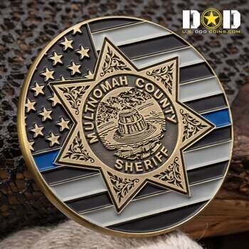 Multnomah County Sheriff challenge coin featuring a seven-pointed star badge over a thin blue line American flag design.