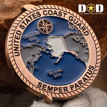 United States Coast Guard challenge coin featuring a map of Alaska, Chukchi Sea, Bering Sea, and a compass rose on a blue background.