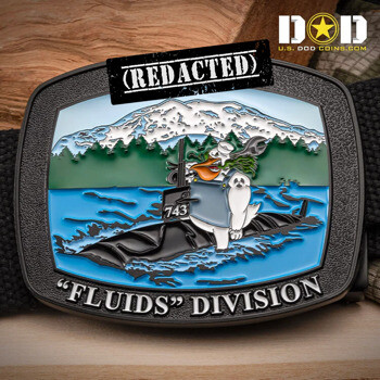 Custom belt buckle featuring a cartoon character on a submarine numbered 743 with 'Fluids Division' text and a mountain background.