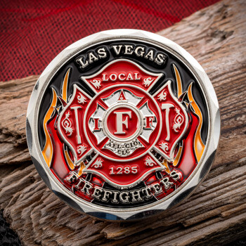 Las Vegas Local 1285 Firefighters challenge coin featuring a red and silver Maltese cross with flames on a black background.