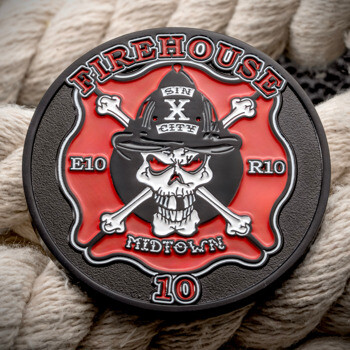 Red and black challenge coin featuring a skull with crossbones, a firefighter helmet, and the text Firehouse Midtown 10.
