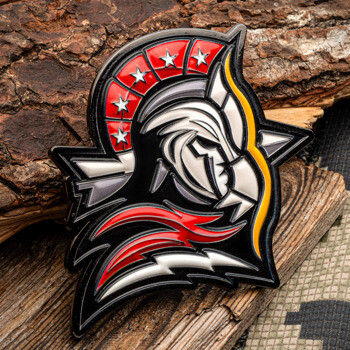 Custom die-cut lapel pin featuring a stylized spartan helmet with red and white stars on the crest and lightning bolt accents.