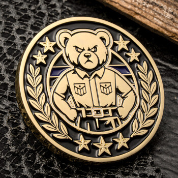 Gold and black challenge coin featuring an angry grizzly bear in a military uniform surrounded by stars and laurel wreaths.