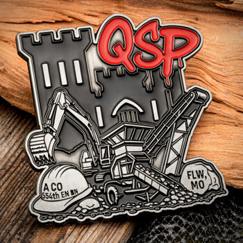 Custom Coin featuring red QSP lettering, a castle silhouette, an excavator, a rock crusher, and a hard hat for the A CO 554th EN BN.