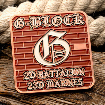 Square copper challenge coin featuring a brick wall background, a Gothic G logo, and text for G-Block 2d Battalion 23d Marines.