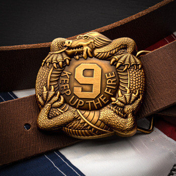 Antiqued gold dragon belt buckle featuring the number 9 and the text Keep Up The Fire on a brown leather belt.