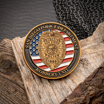 San Diego Police Department Robbery Unit challenge coin featuring a gold detective badge over a red, white, and blue flag background.
