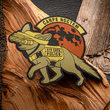 Embroidered morale patch featuring a military working dog wearing night vision goggles and a vest, set against a red moon with the text 379 ESFS Police.