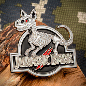 Jurassic Bark lapel pin featuring a canine skeleton design with red claw marks on a black circular background.