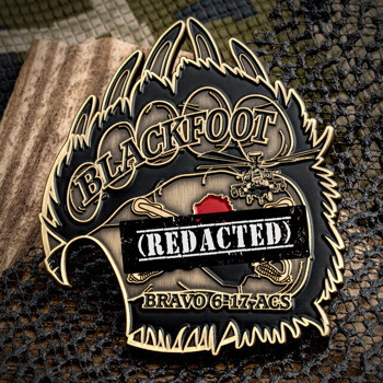 Bear paw shaped challenge coin featuring an attack helicopter, military insignia, and the text Blackfoot Bravo 6-17 ACS.