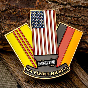 Shield-shaped challenge coin featuring the US flag, South Vietnamese flag, and German flag with Six Penny Nickels text.