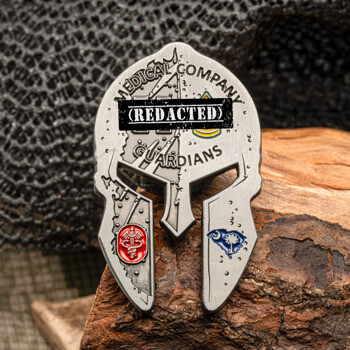 Spartan helmet shaped challenge coin featuring Medical Company Guardians text with red medical and blue South Carolina insignia.