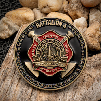 A circular challenge coin for Las Vegas Fire & Rescue Battalion 4 featuring a red and bronze maltese cross design on a black background.