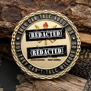 Gold-plated challenge coin with a diamond-cut edge, featuring a torch and crossed spears emblem with the text They Can Talk About Us But They Can't Talk Without