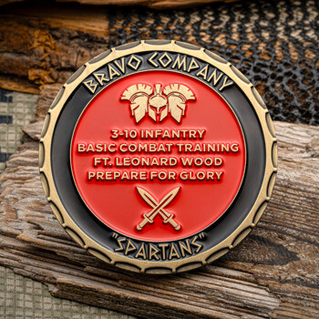 Bronze challenge coin featuring the Bravo Company Spartans emblem with a red center, spartan helmets, and crossed swords.