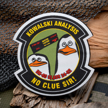 Circular embroidered patch featuring two penguins, the text Kowalski Analysis and No Clue Sir, and UH-60 Class 24-02.