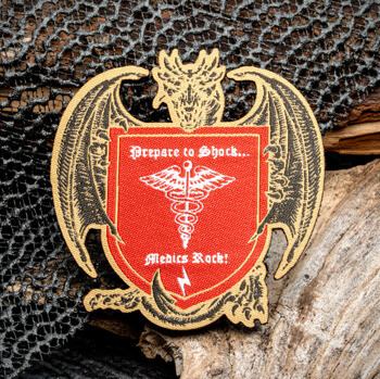 Embroidered patch featuring a dragon holding a red shield with a caduceus symbol and the text Prepare to Shock... Medics Rock!