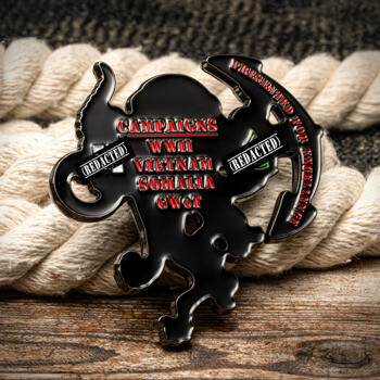 Custom cut-out challenge coin shaped like an octopus with red text listing WWII, Vietnam, Somalia, and GWOT campaigns.