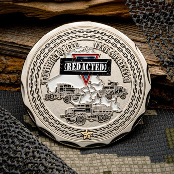 Silver challenge coin featuring military transport vehicles, a map of Iraq, and the text Transition of Iraq Iraqi Governance.