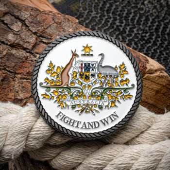 Round challenge coin featuring the Commonwealth Coat of Arms with a kangaroo and emu on a white background with a rope border.