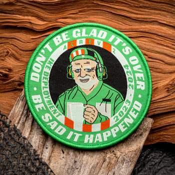 Circular embroidered patch featuring a caricature of a man holding a mug with the text 'Don't be glad it's over, be sad it happened'.
