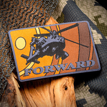 Rectangular embroidered patch featuring a military helicopter silhouette, the word Forward, and a sun graphic on an orange and brown background.