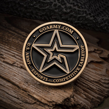 Gold and black U.S. Army Esports Competitive Tabletop challenge coin featuring a central star emblem on a wooden surface.
