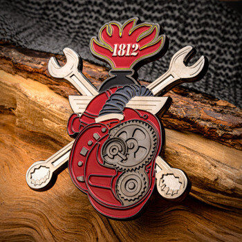 Custom lapel pin featuring a red mechanical anatomical heart with gears, crossed wrenches, and an 1812 flame emblem.