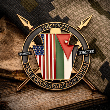 Task Force Spartan Jordan challenge coin featuring crossed spears, the US flag, and Jordan flag elements, dated 2022-2023.