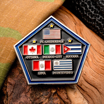 Pentagon-shaped challenge coin featuring five national flags including Canada, Mexico, Cuba, Peru, and Uruguay, with corresponding capital cities.