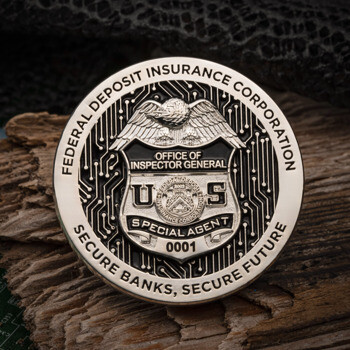 Federal Deposit Insurance Corporation Office of Inspector General Special Agent challenge coin with a circuit board design, displayed on wood.