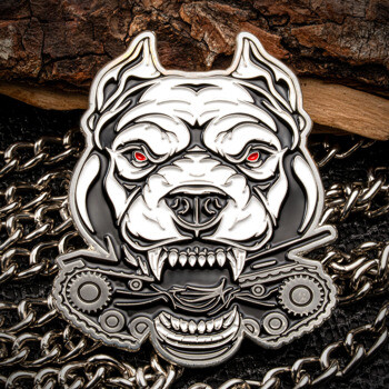 Custom metal lapel pin featuring an aggressive pitbull head with red eyes biting a mechanical gear assembly, rendered in silver and black enamel.