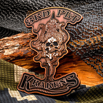 Custom cut-out challenge coin with a skull and octopus design featuring the words 3rd Plt Krakens in antique copper finish.