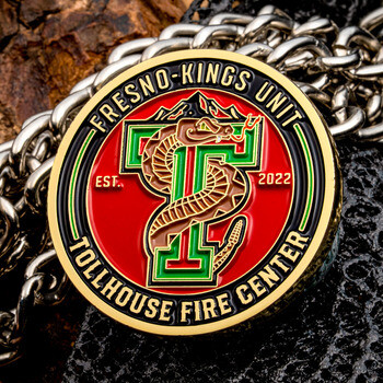 Fresno-Kings Unit Tollhouse Fire Center challenge coin featuring a rattlesnake wrapped around the letter T over a red and gold background.