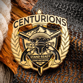 Gold and black Centurions challenge coin featuring a Spartan helmet, crossed pistols, laurel wreath, and the motto Stand Ready.