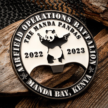 Airfield Operations Battalion The Manda Pandas bottle opener challenge coin featuring a panda wielding pistols.