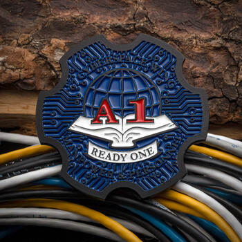 Custom blue and black cut-to-shape challenge coin featuring A-1, a globe, and circuit board patterns over network cables.
