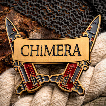 Custom cut-to-shape metal lapel pin featuring the word CHIMERA across a scroll banner over crossed stylized daggers.