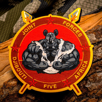 Embroidered military patch featuring a muscular rhino flexing on a red background with text reading Joint Forces Djibouti Africa Five.
