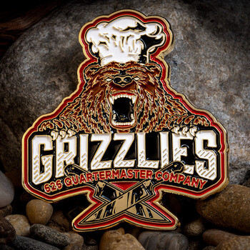 Custom cut-to-shape lapel pin featuring a roaring grizzly bear in a chef hat with crossed cleavers for the 626 Quartermaster Company Grizzlies.