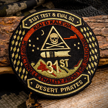 Embroidered military patch for the 31st Test & Eval Sq Desert Pirates featuring a skull, pyramid, and bomb on wood bark.