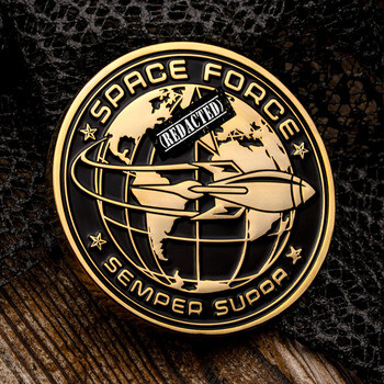 Gold and black Space Force challenge coin featuring a globe, rocket, and Semper Supra motto.