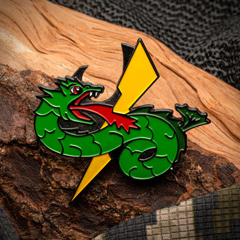Enamel lapel pin shaped like a green serpent wrapped around a yellow lightning bolt.